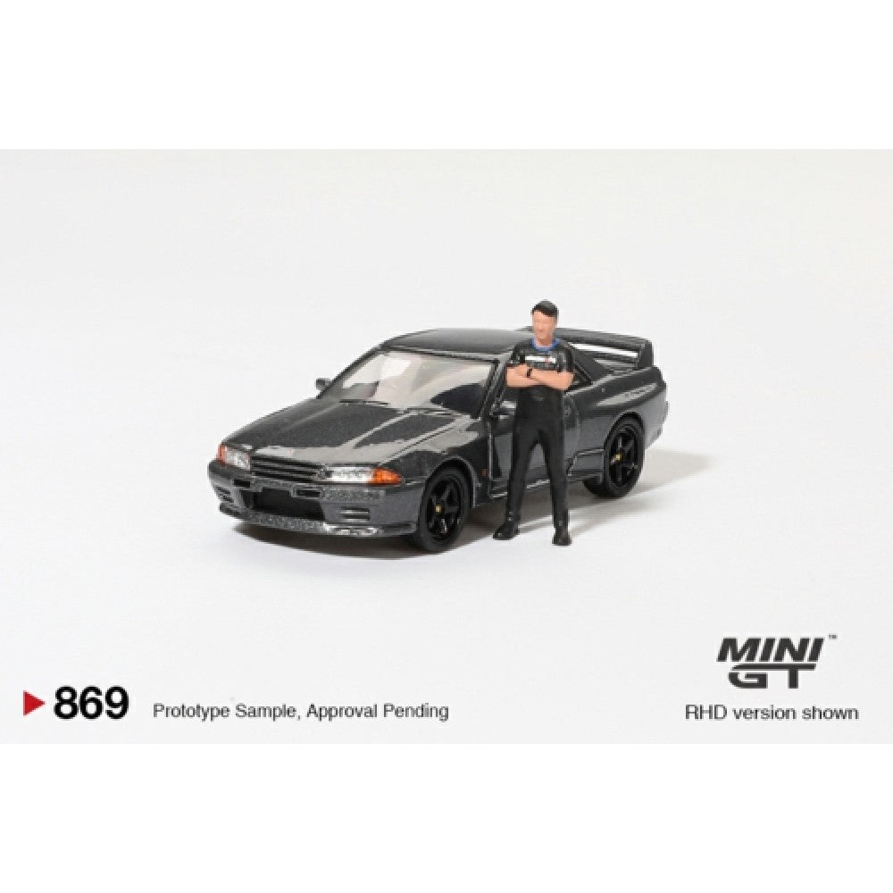1:64 MINI GT MGT00869-R NISSAN SKYLINE GT-R (R32) NISMO GUNMETAL WITH MATSUDA FIGURE (RHD)