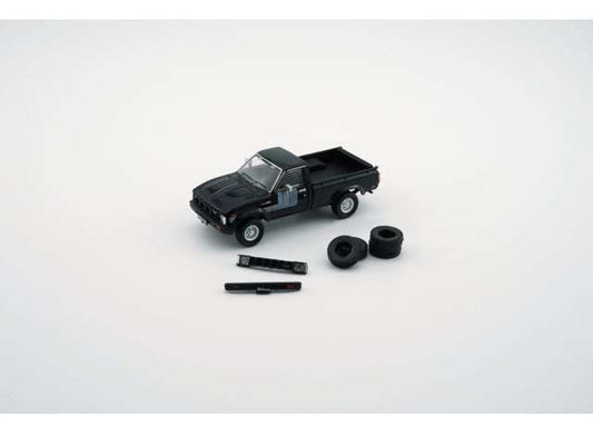 Toyota Hilux, black left hand drive with extra set of wheels and bumpers. 1:64 BM Creations Model