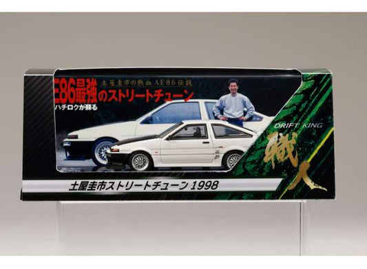 Pre-Order – Toyota Sprinter Trueno GT APEX (AE86) *DK Tsuchiya Street Tuning 1998*, white 1:64 Hobby Japan Model (HJ646052DDK) – ETA. March 2027