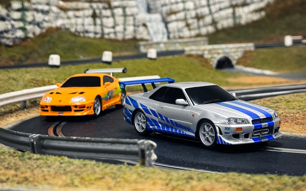Available To Order – Fast and Furious Set 25 Years Supra vs R34 1:32 Scalextric Model (SCA C1465M)