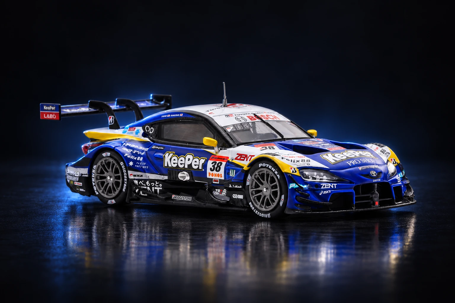 Blue, white and yellow Spark Toyota GR Supra GT500 number 38 scale model